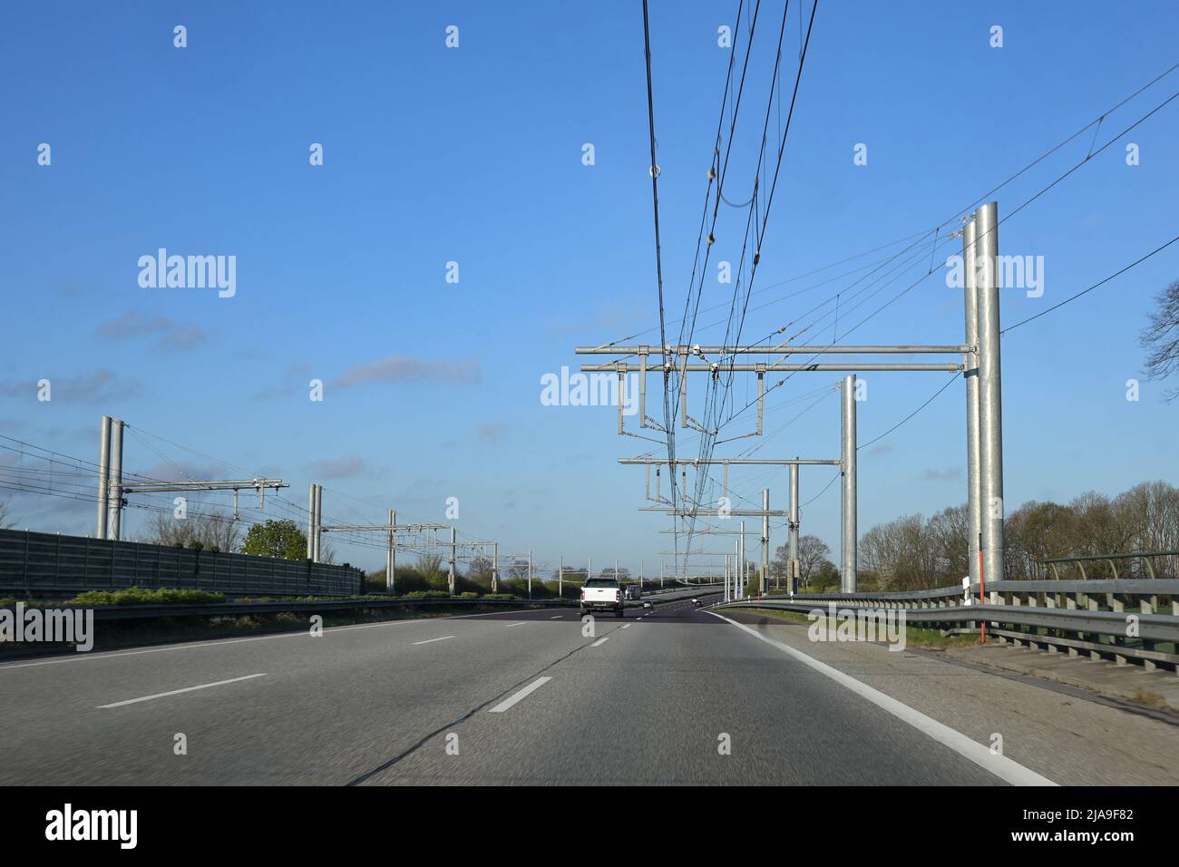 E-highway, test section with electric overhead lines for hybrid trucks on the autobahn in Schleswig Holstein, Germany, copy space, selected focus Stock Photo