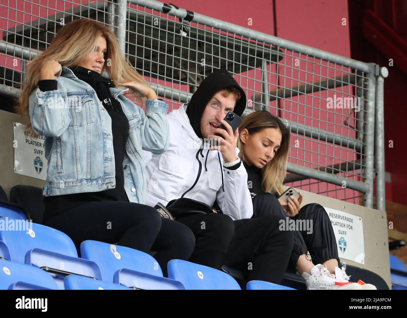 Swedish footballer Dejan Kulusevski, currently playing for Tottenham Hotspur on loan from Juventus, with his sister Sandra Kulusevska (left) and  his girlfiend and fellow footballer Eldina Ahmic (right) at a soccer game where they watched Sandra's boyfriend Abdelkarim Mammar Chaouche play for Athletic Eskilstuna  in Eskilstuna, Sweden 28 May 2022  Photo: Per Karlsson / TT / code 11723 Stock Photo