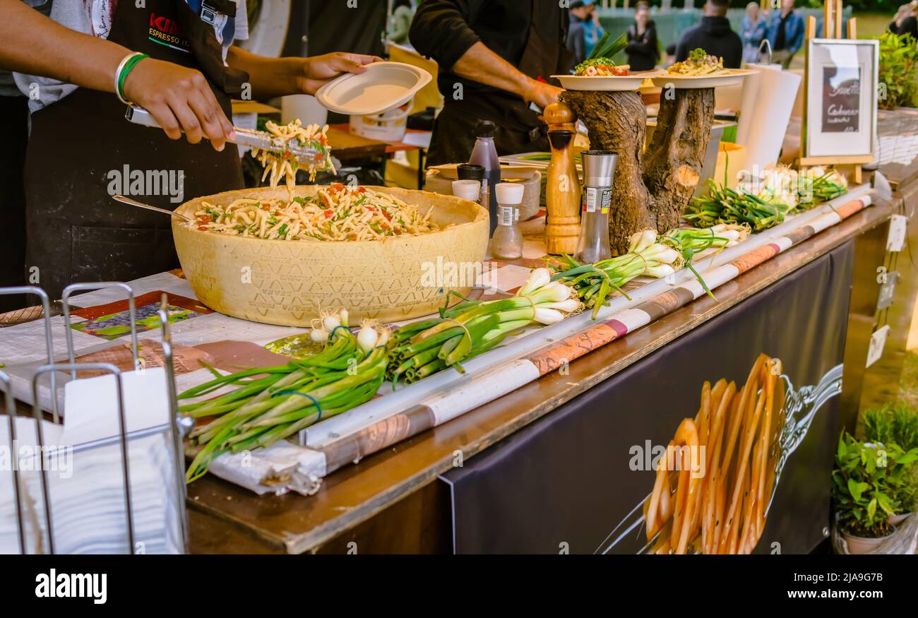 Hockenheim, Germany - May 28, 2022: Street food festival, preparing pasta at food truck Stock Photo