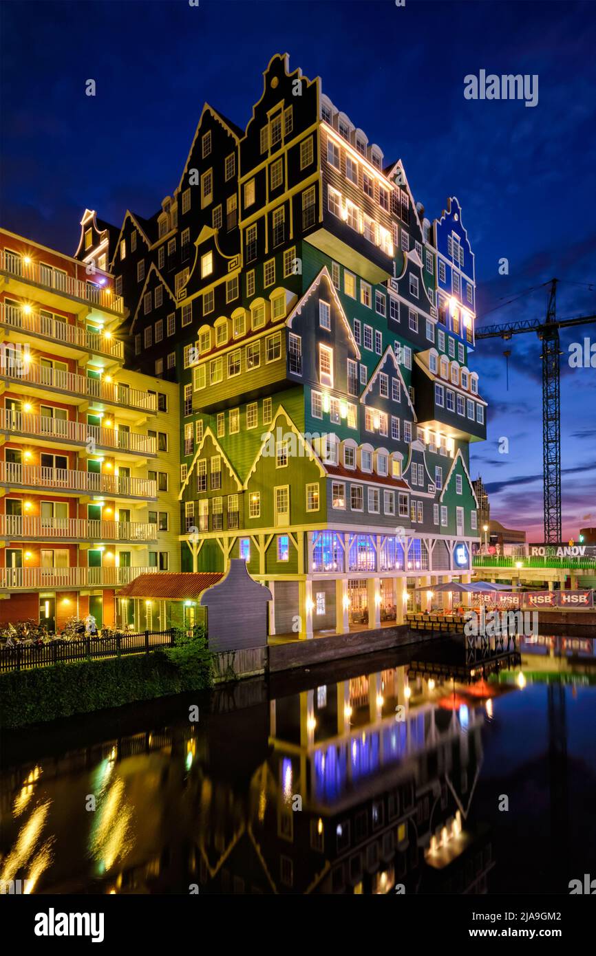 ZAANDAM, NETHERLANDS - MAY 21, 2018: Inntel Hotel in Zaandam illuminated at night. Design of 12-storey tall building opened in 2009 is the result of s Stock Photo