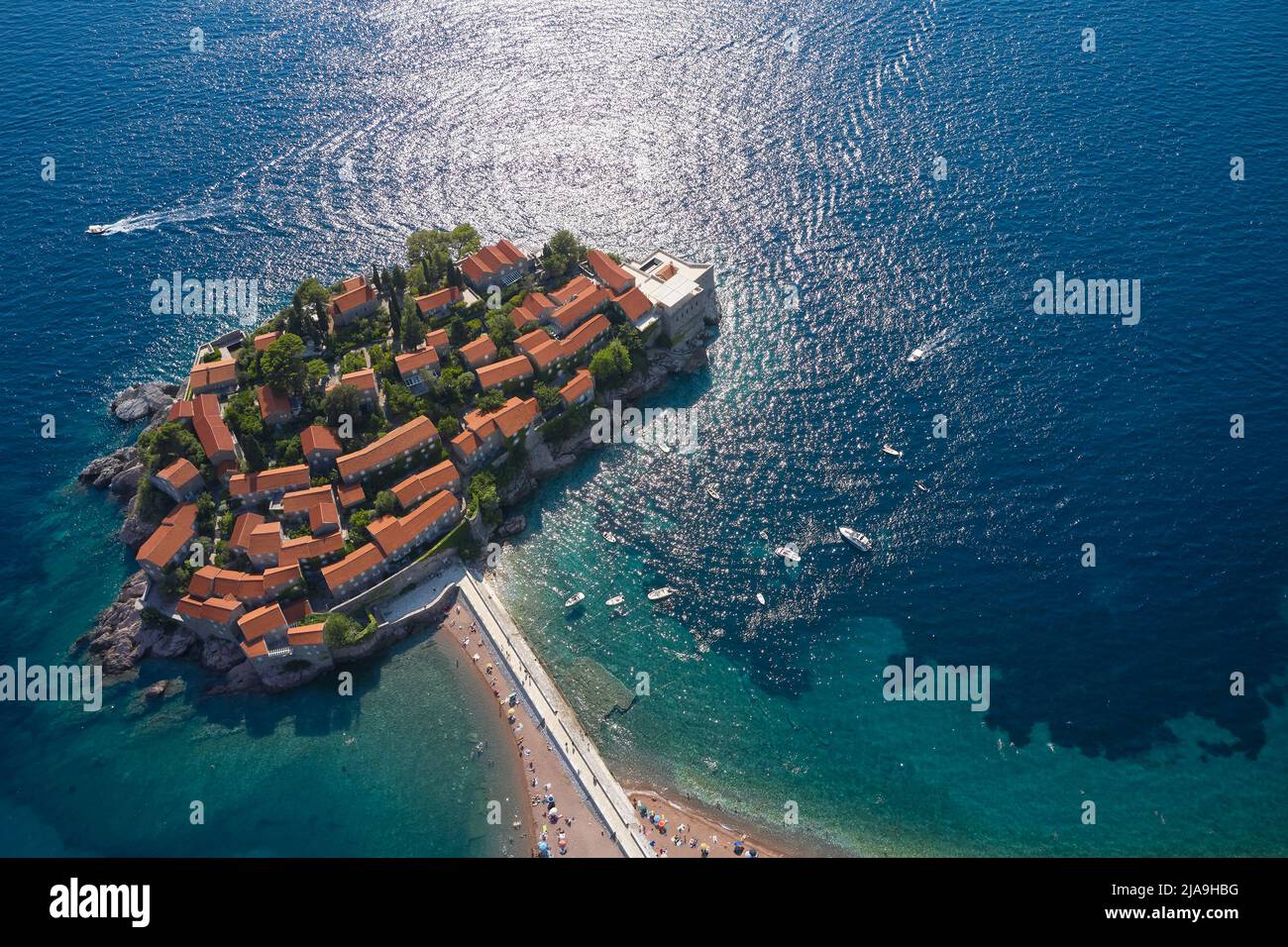 Island in sea with houses, Aerial view of Sveti Stefan, Montenegro Stock Photo