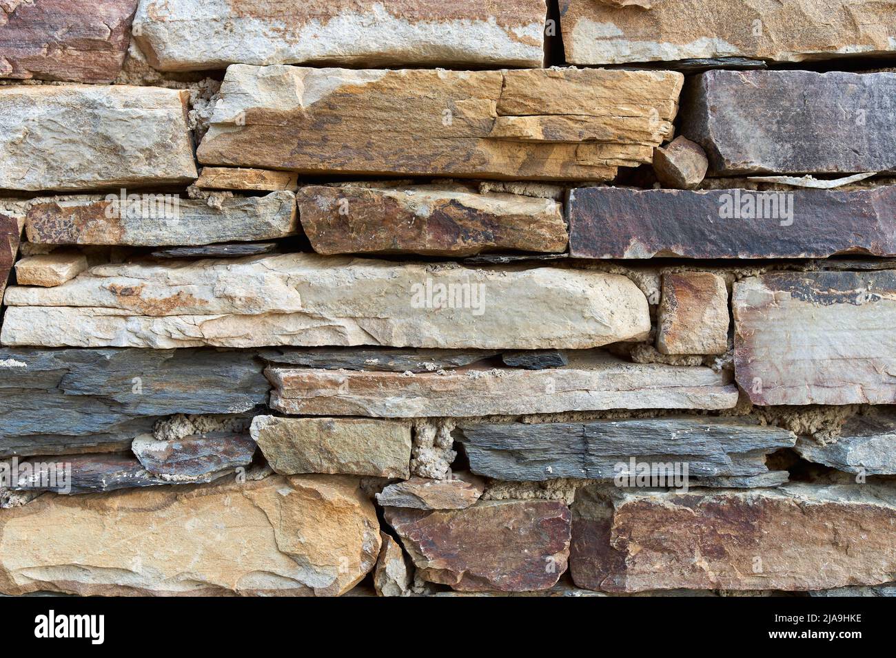 Rectangular stone wall in ocher tones Stock Photo