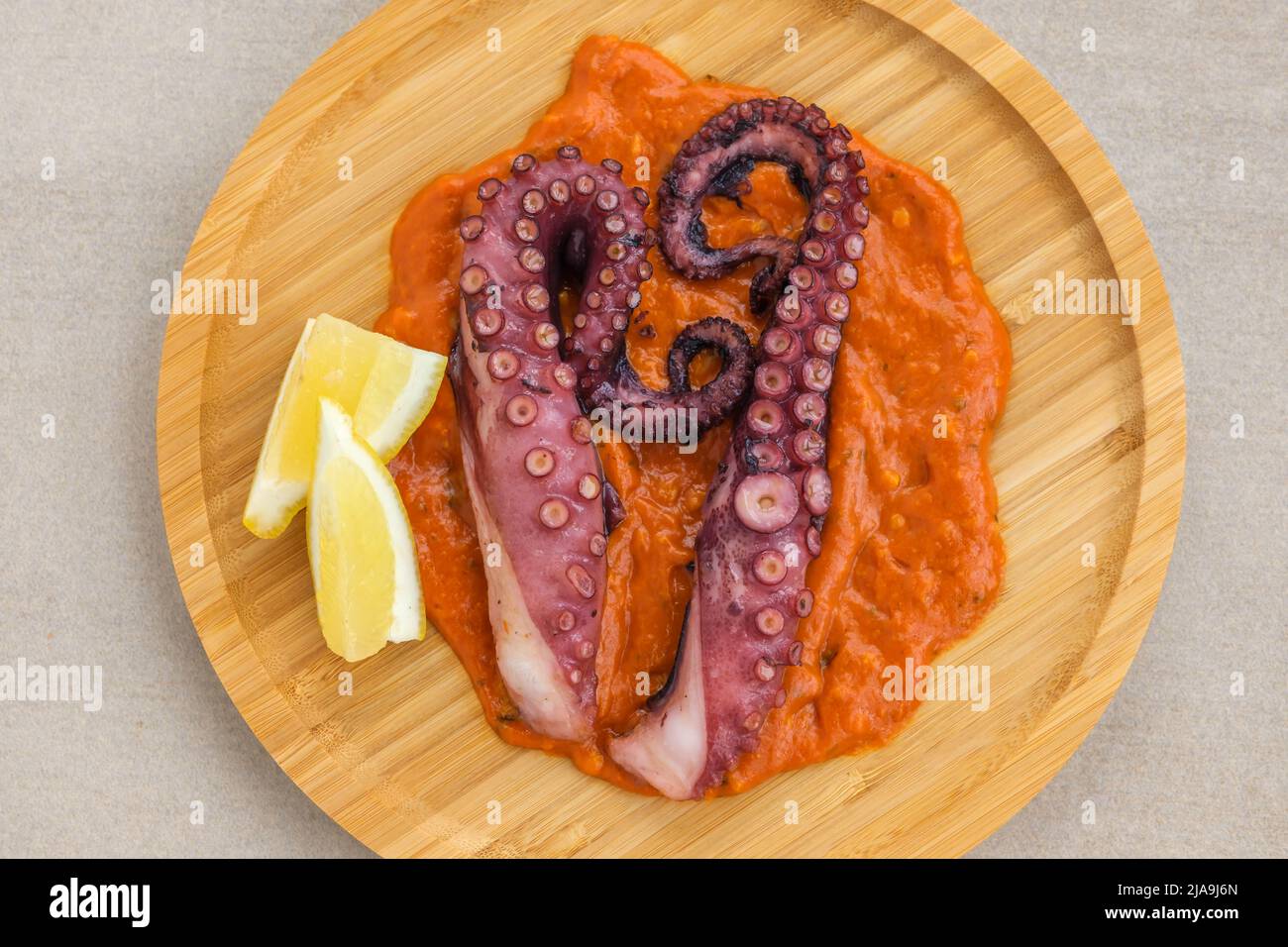 Roasted octopus tentacles with chilli romesco sauce Stock Photo Alamy