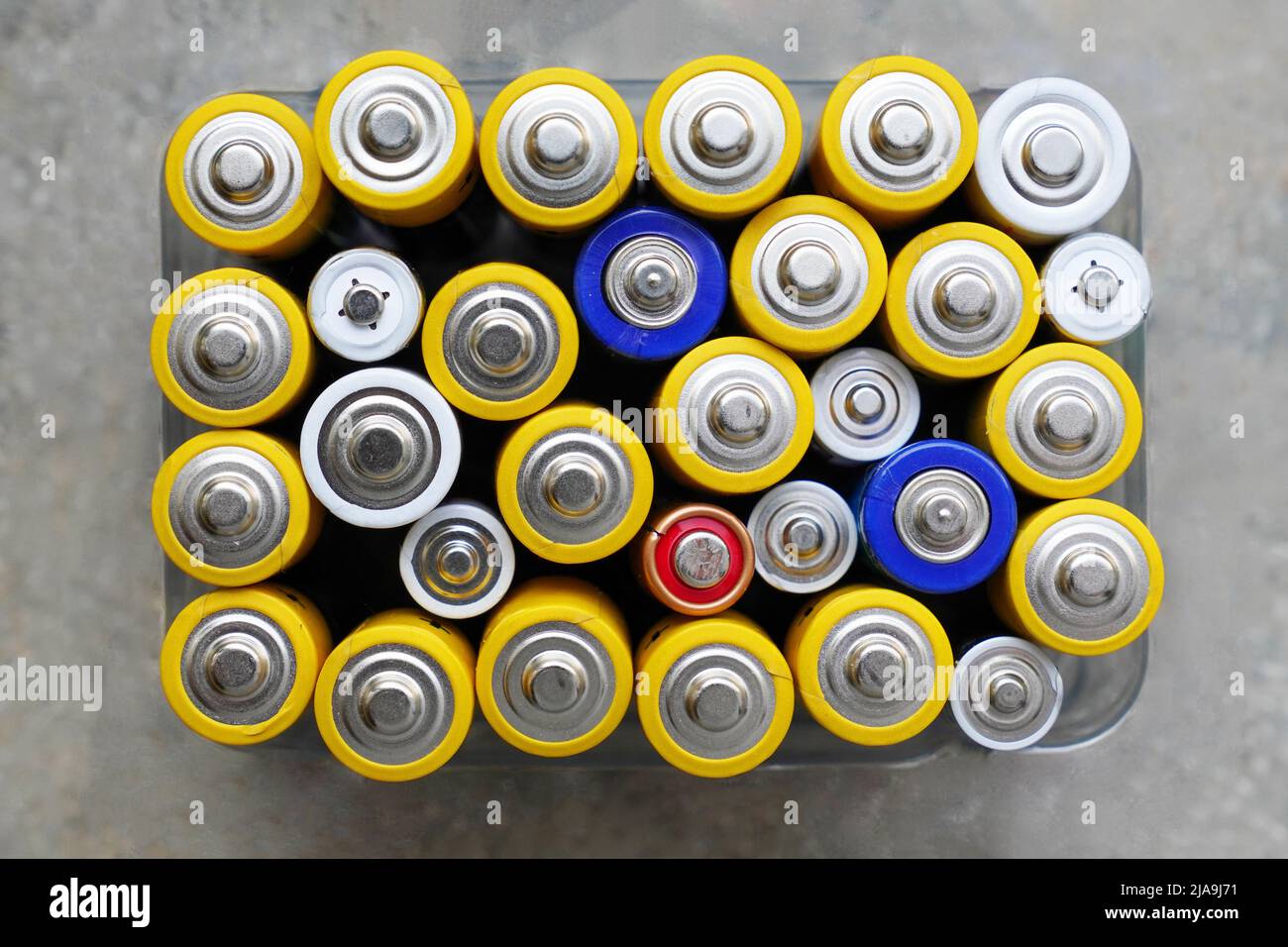 collecting used alkaline batteries for recycling Stock Photo