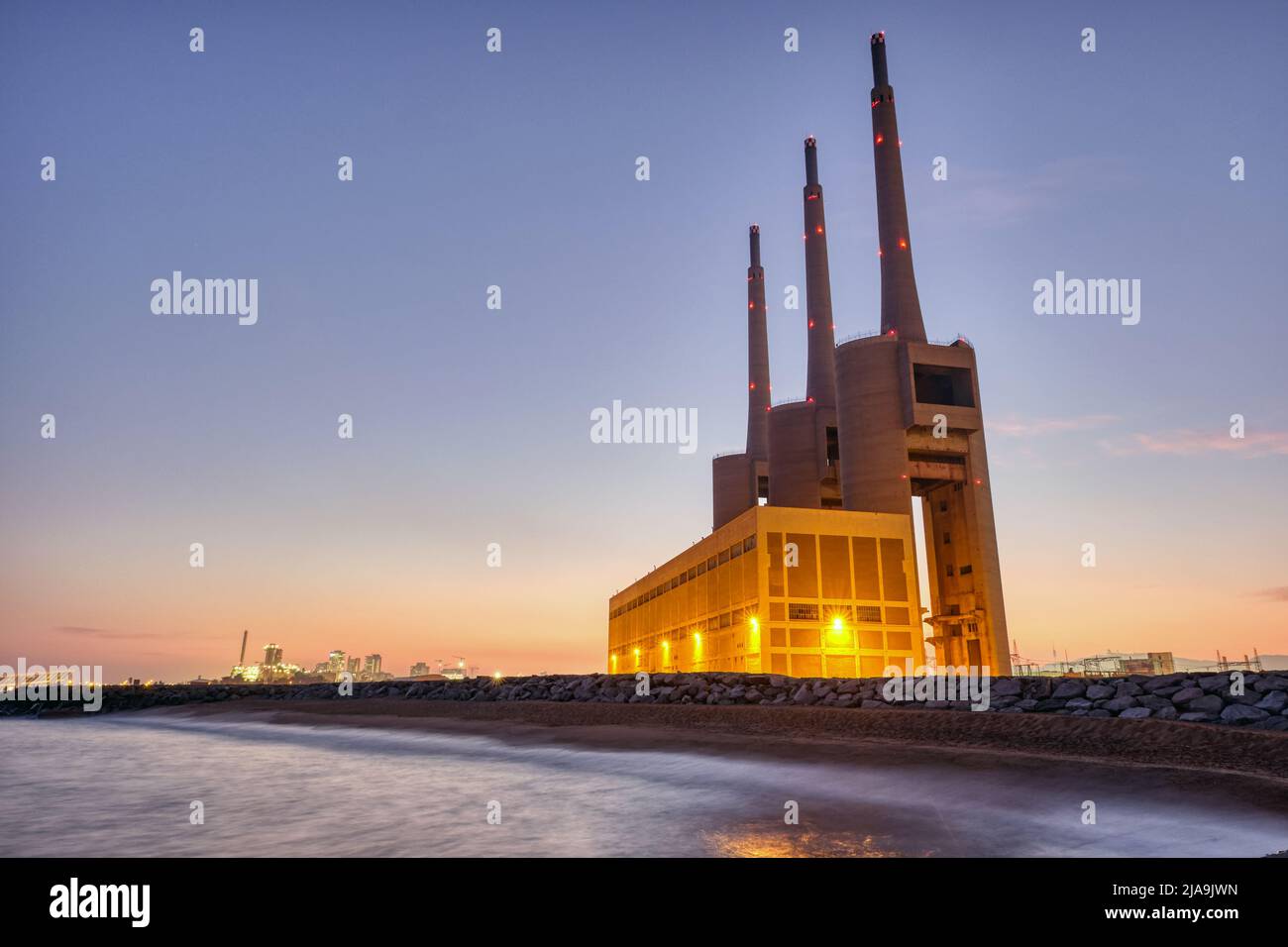 The shut-down thermal power station at Sant Adria near Barcelona at twilight Stock Photo