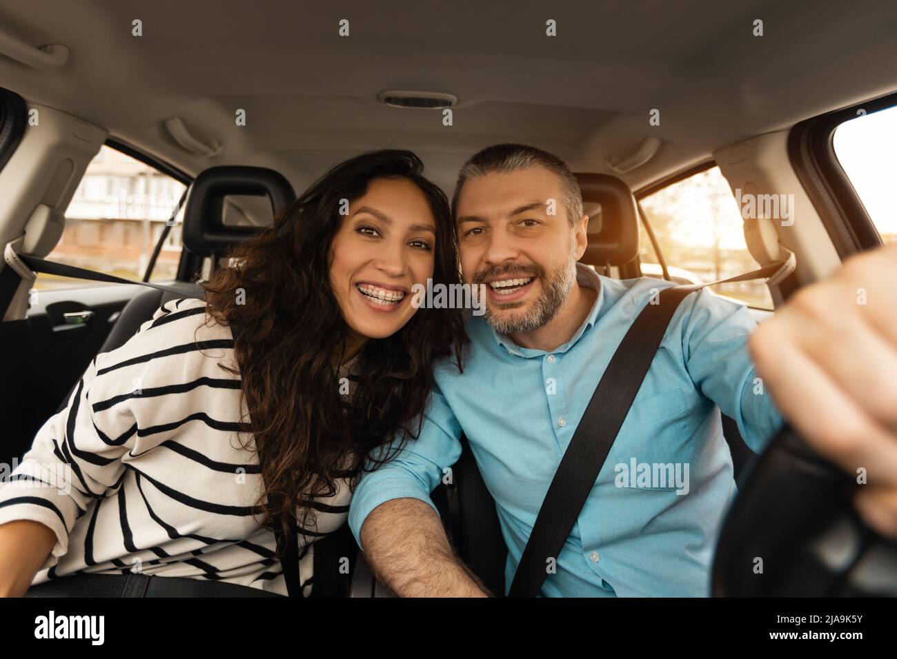 Happy couple sitting in car hi-res stock photography and images - Alamy