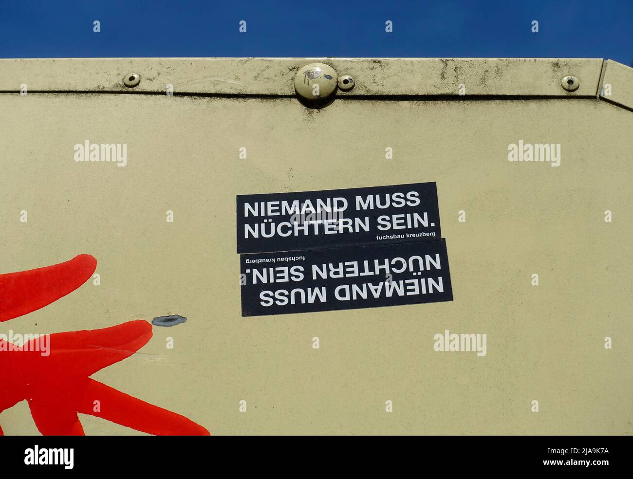 Sticker in Berlin, no one needs to be sober Stock Photo