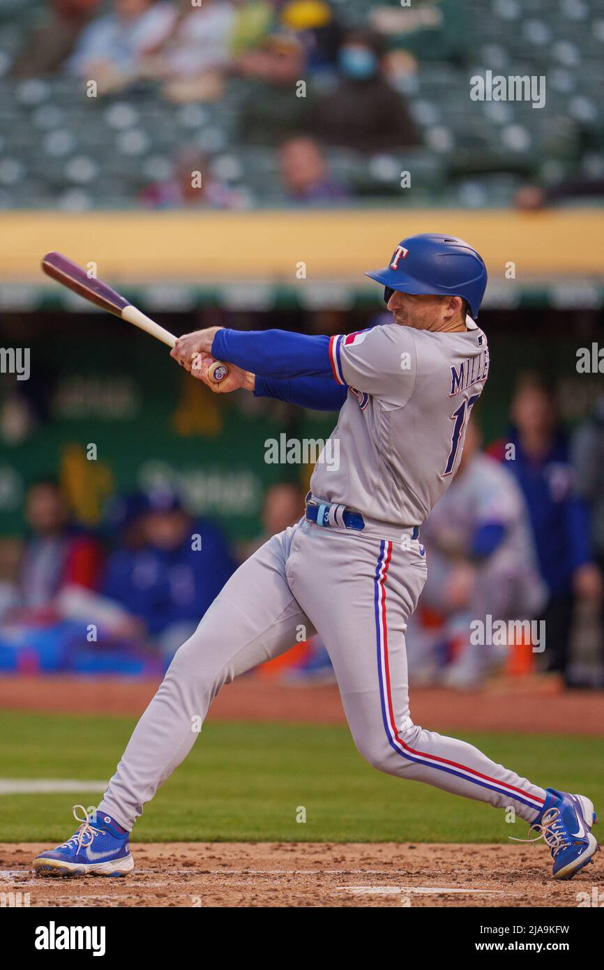 Texas Rangers left fielder Brad Miller (13) swings at a pitch during the  fourth inning against the Oakland Athletics in Oakland, CA Thursday May 26,  2 Stock Photo - Alamy