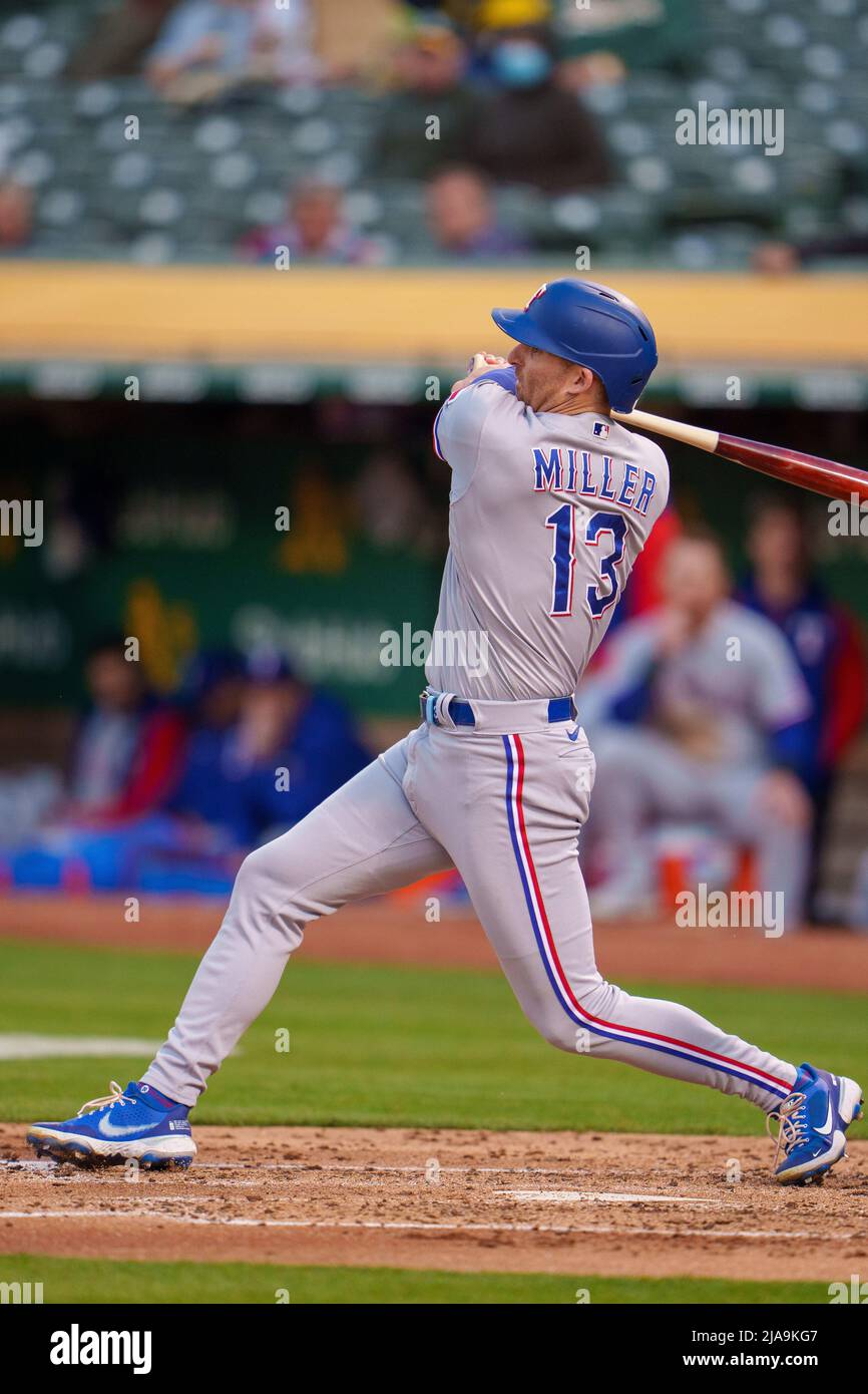 Texas Rangers left fielder Brad Miller (13) swings at a pitch