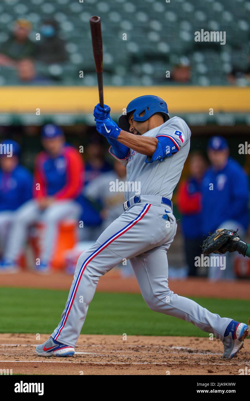 Texas Rangers second baseman Marcus Semien (2) swings at a pitch during the  second inning against the Oakland Athletics in Oakland, CA Thursday May 26  Stock Photo - Alamy