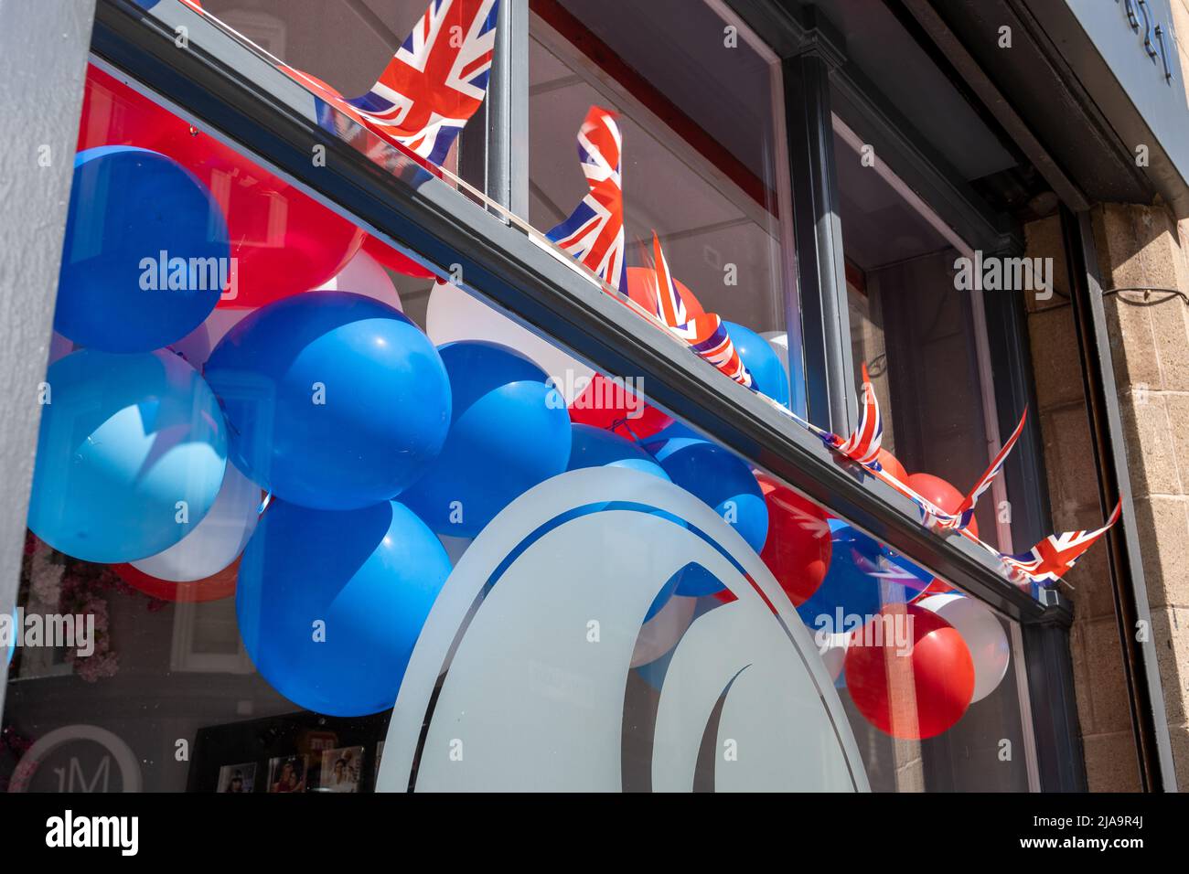 Union Jack decor bunting and balloons in a shop window in Newcastle