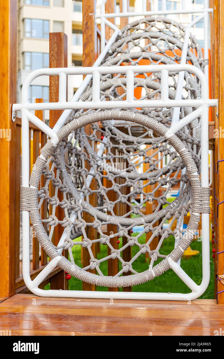 rope tunnel for children to play in a residential area vertical composition Stock Photo Alamy