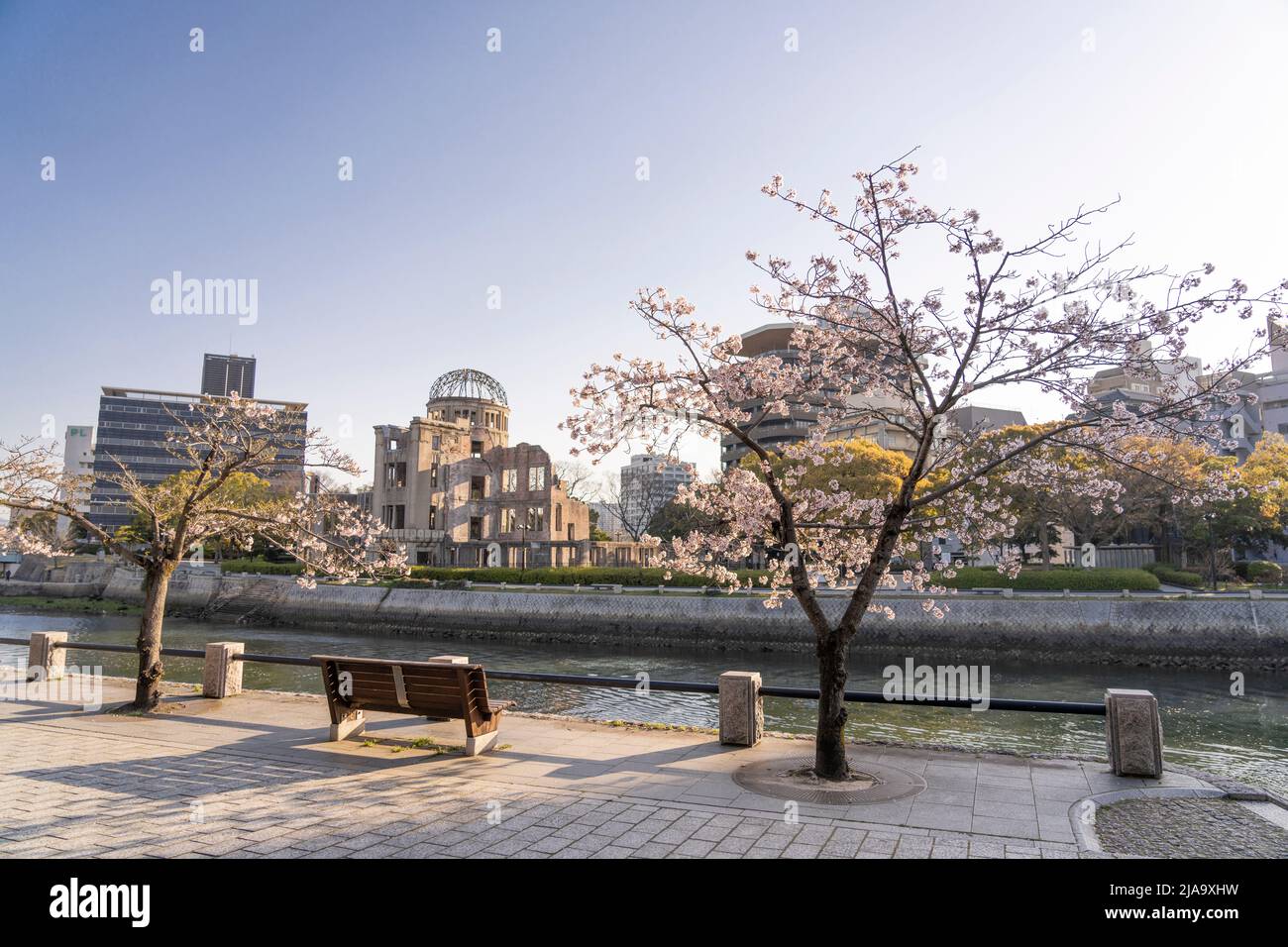 Motoyasu-gawa River, cherry blossom, and the Rest House of Peace Memorial Park, Hiroshima City, Western Honshu, Japan Stock Photo