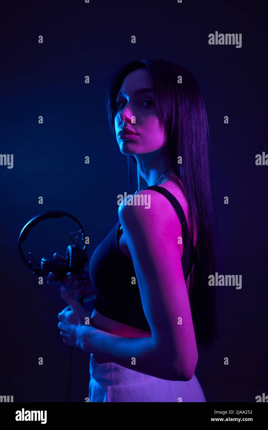 Elegant brunette lady standing straight 