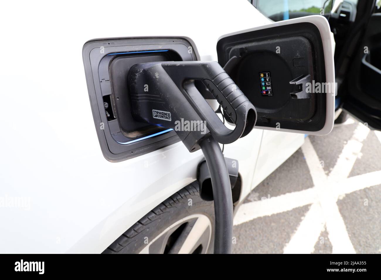 Electric Vehicle Charging Station; CCS connector supplying 120kW DC charge to an electric vehicle Stock Photo
