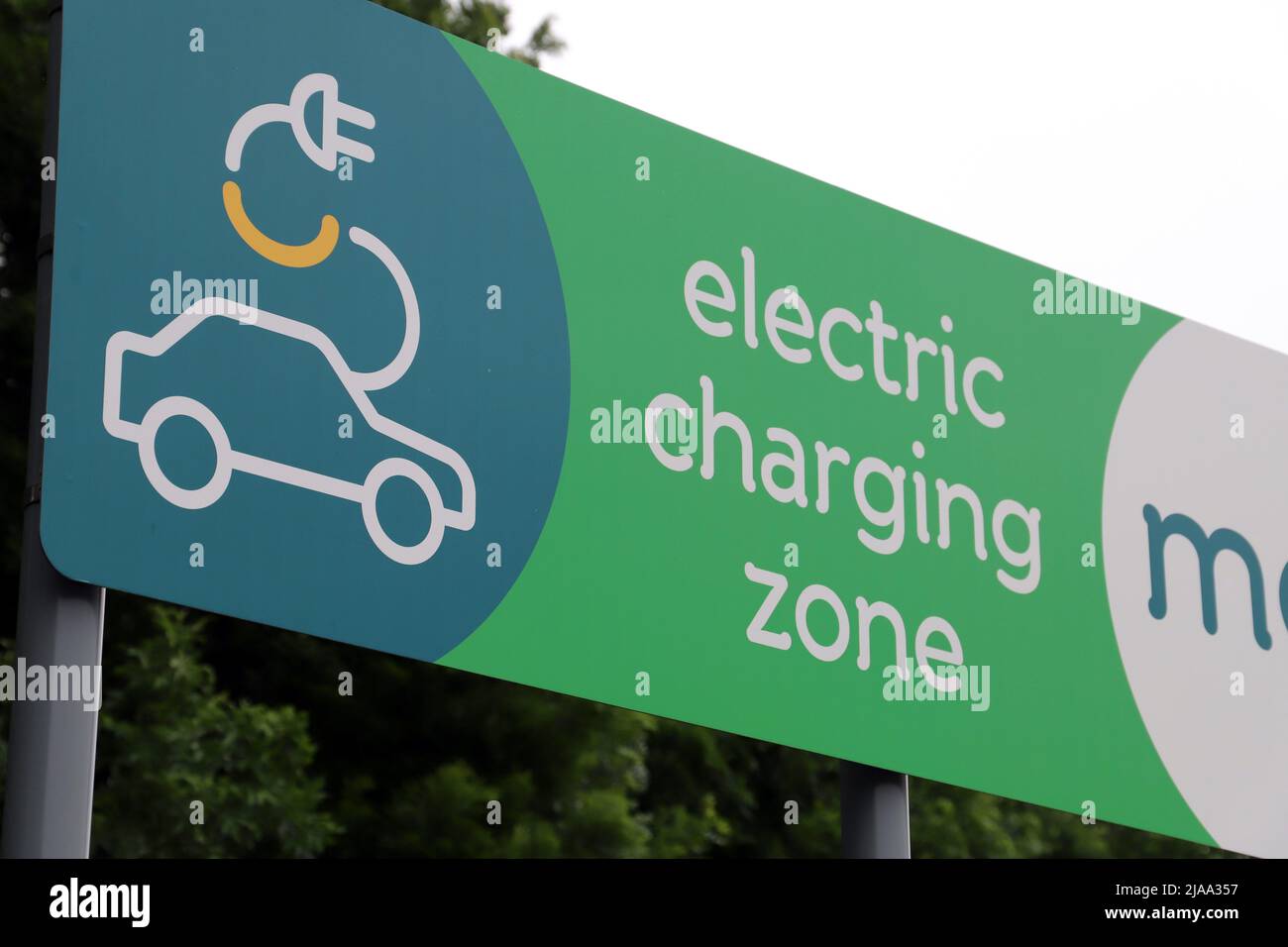 Electric Vehicle Charging Station Sign at Moto Donington Park Services on the M1 motorway Stock Photo