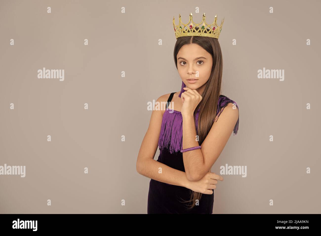Ambitious girl wear luxury jewelry crown grey background copy space, big boss Stock Photo