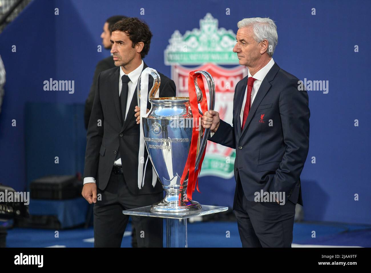 Paris, France. 28th May, 2022. Former Real Madrid player Raul (L) and former Liverpool FC player Ian Rush (R) carry the trophy before the UEFA Champions League final between Liverpool and Real Madrid at the Stade de France in Paris. (Photo Credit: Gonzales Photo/Alamy Live News Stock Photo