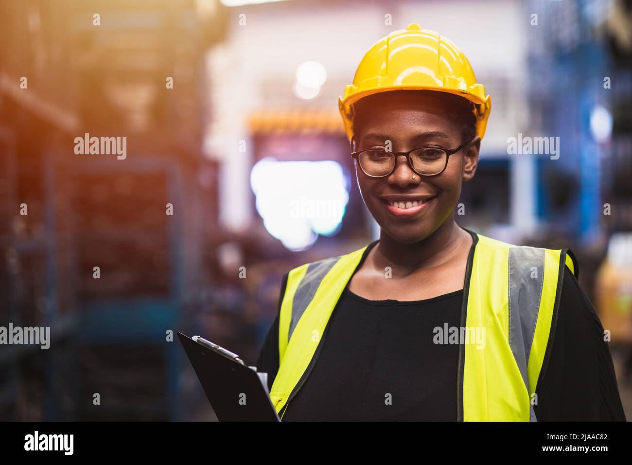 Engineer black women worker, Professional woman afican mechanical maintenance work in factory Stock Photo