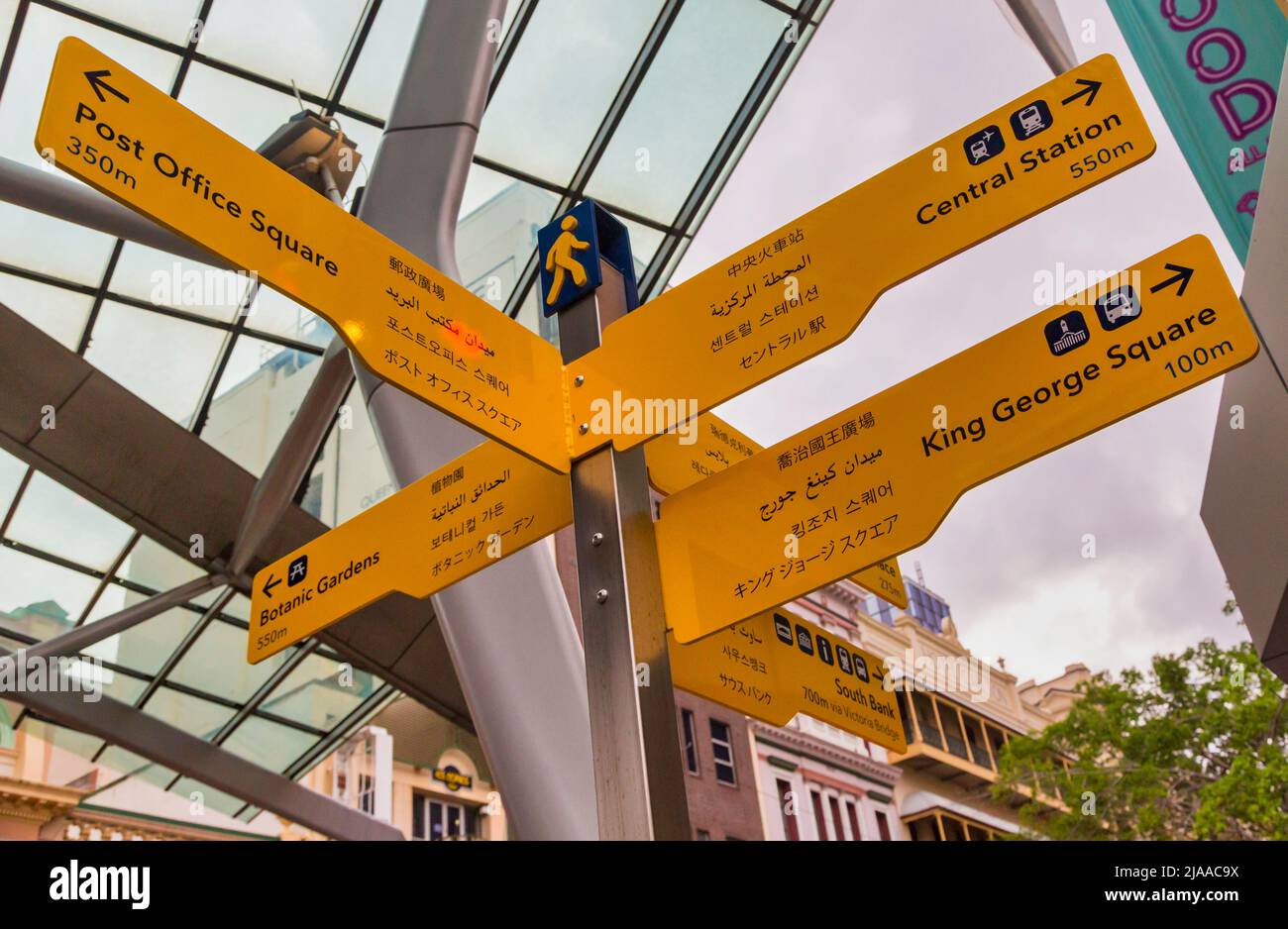 Signposts in English and multiple Asian languages, Brisbane, Queensland, Australia. Stock Photo