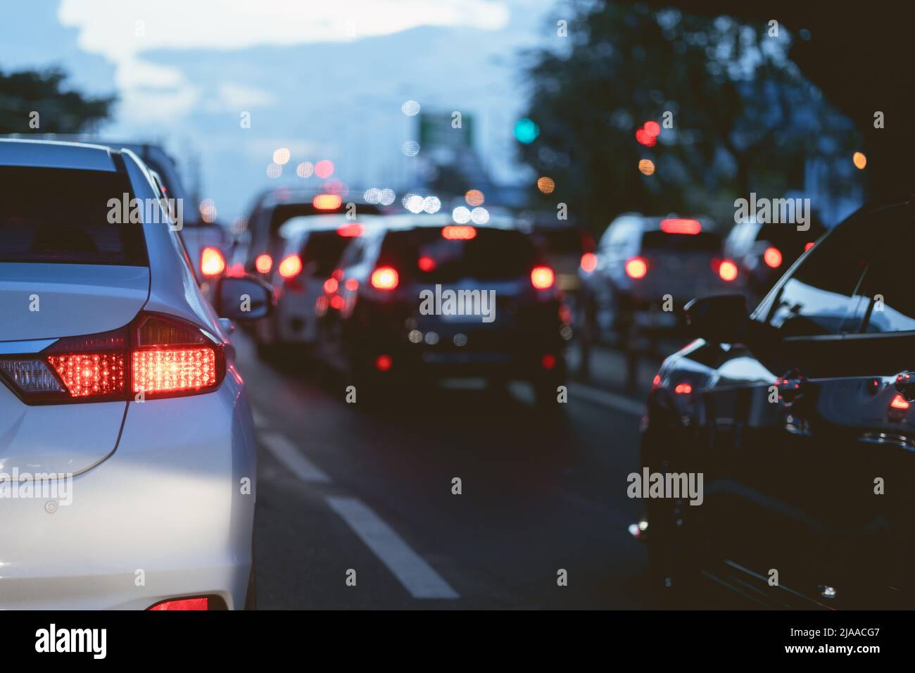 traffic jam many cars stuck on road in evening time off working hours. Stock Photo