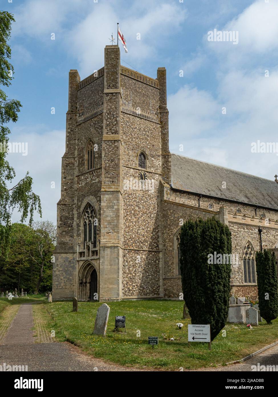 The 19th century tower of St Bartholomews church Orford on a bright sunny day. Stock Photo