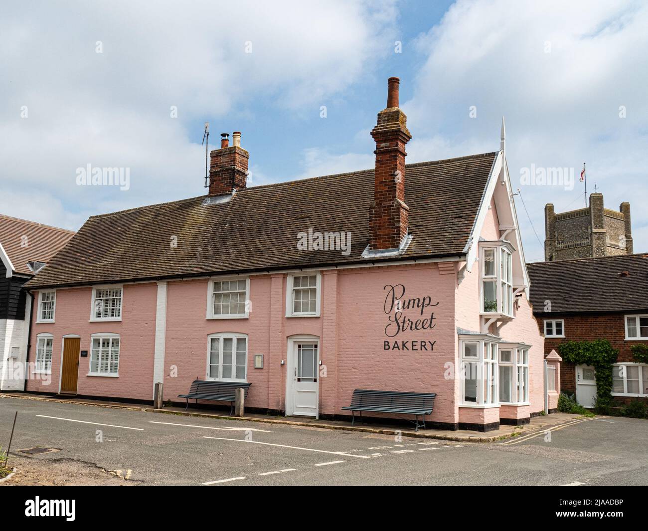 The distinctive pink exterior of the Pump Street bakery in Orford Suffolk Stock Photo