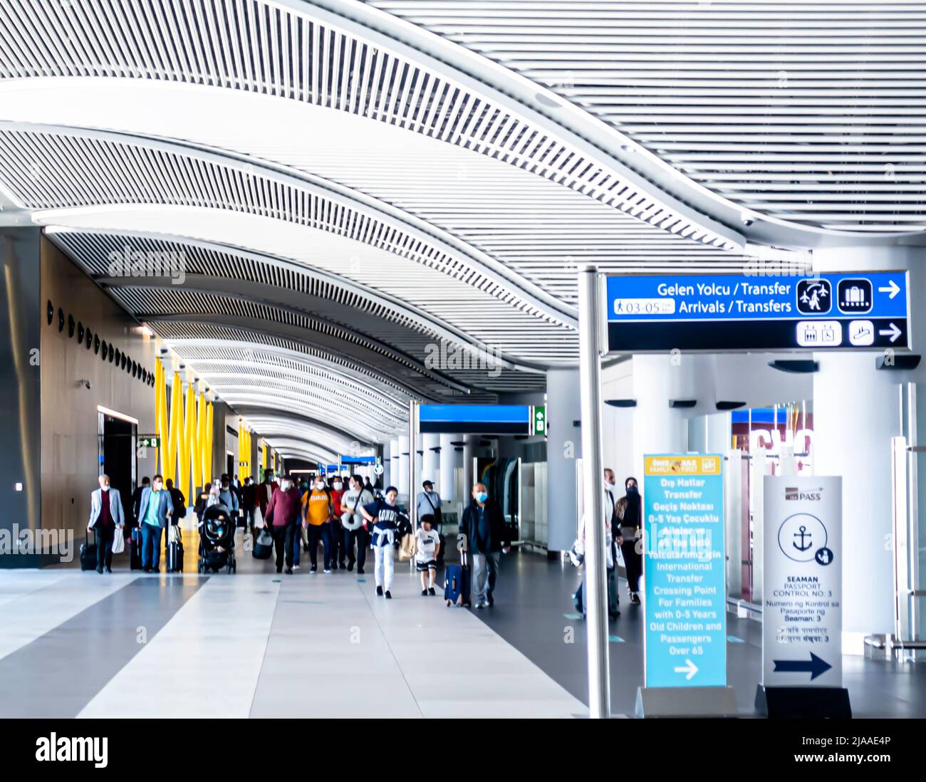 Group of passengers walking at arrivals, transfer gates, connected