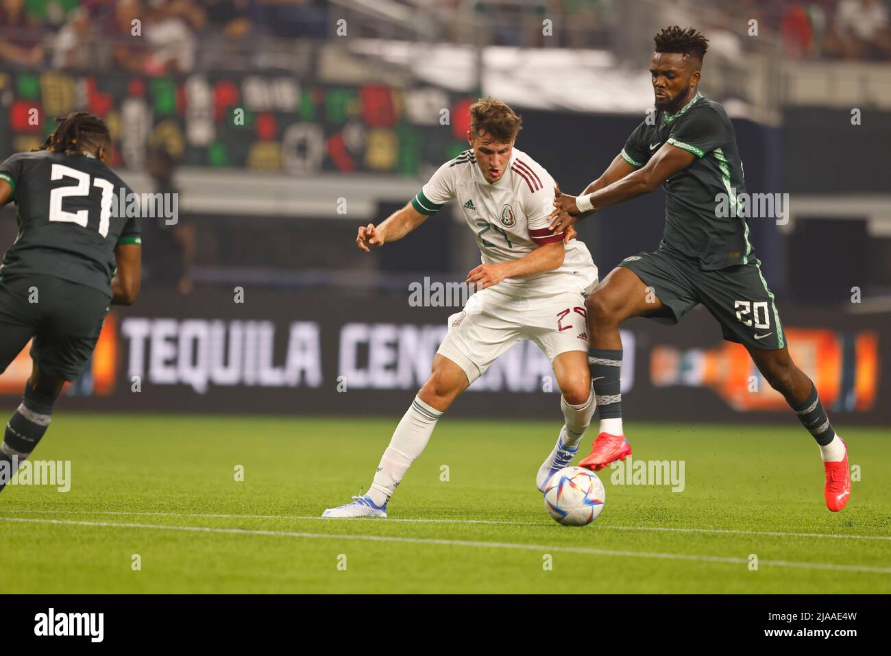 Arlington, Texas, USA. 28th May, 2022. May 28, 2022. Santiago Tomas Gimenez (29) of Mexico and Chidozie Collins Awaziem (20) of Nigeria fight for the ball in a Friendly FÃºtbol match between Mexico and Nigeria at ATT Stadium in Arlington, Texas, USA. (Credit Image: © Ralph Lauer/ZUMA Press Wire) Stock Photo