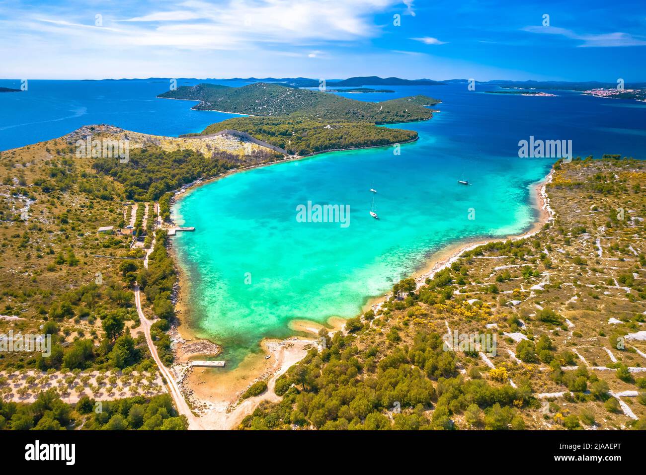 Grebastica turquoise bay and Ostrica historic defence wall ruins aerial view, Dalmatia archipelago of Croatia Stock Photo