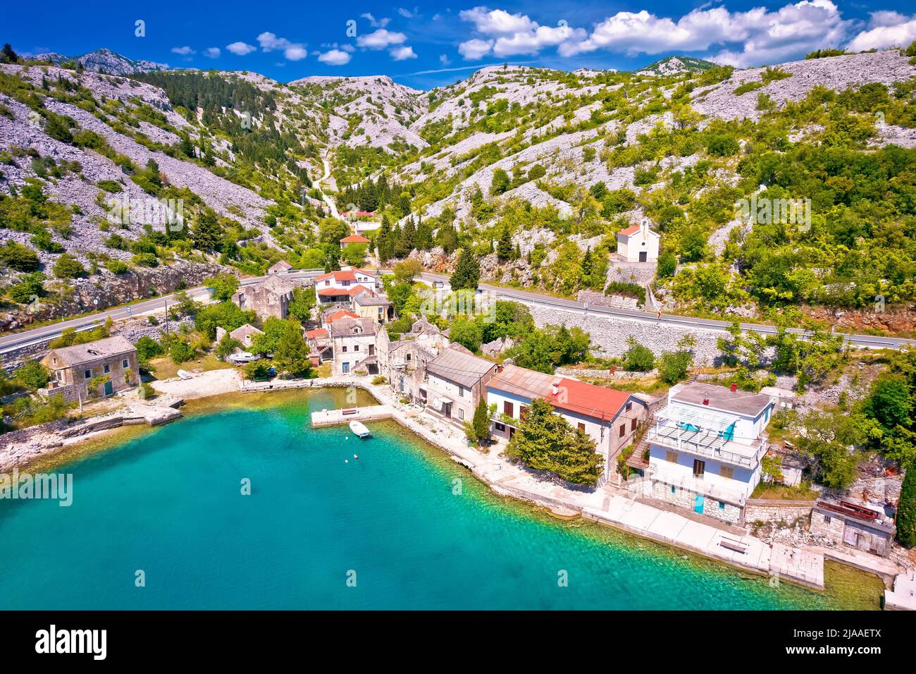 Scenic fishermen village Tribanj Lisarica under Velebit mountain aerial view, archipelago of Adriatic sea in Croatia Stock Photo