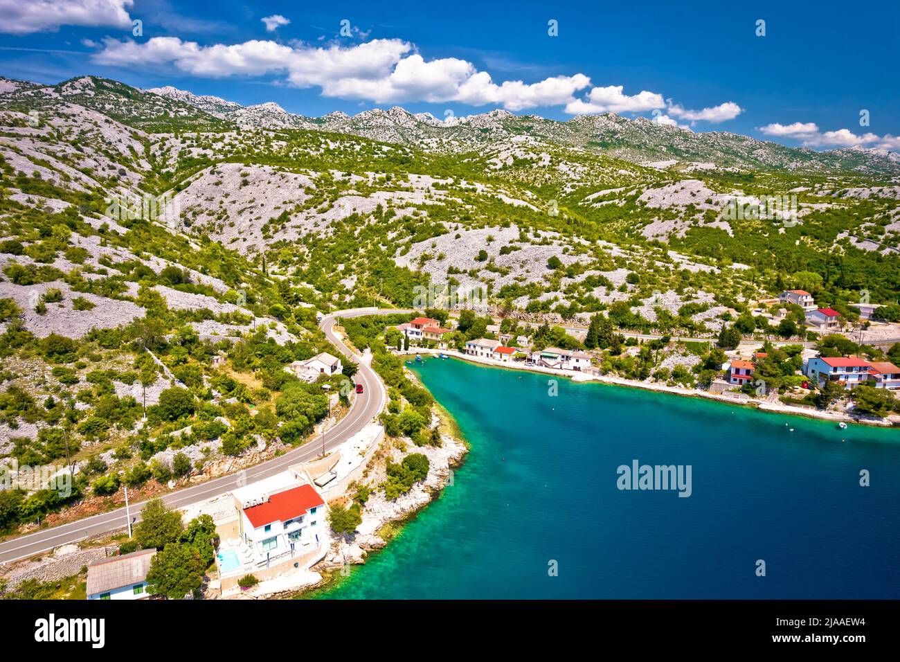 Scenic fishermen village Tribanj Lisarica under Velebit mountain aerial view, archipelago of Adriatic sea in Croatia Stock Photo