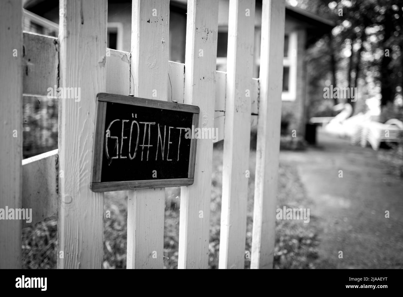 On A Sign On A White Fence Is The Word Open Stock Photo Alamy