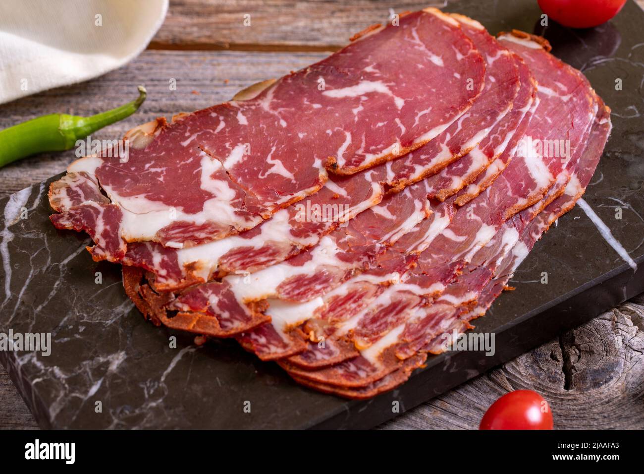 Turkish pastrami. Bacon made from ribeye meat. Beef pastrami sliced