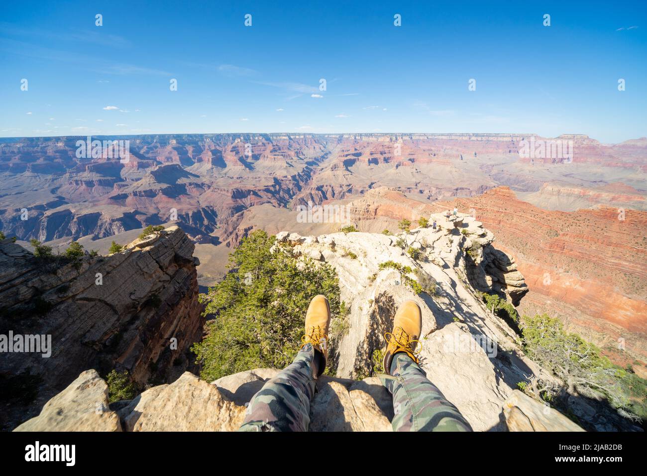 Grand Canyon South Rim, Arizona, USA. Feet of the photographer visible provides perspective. Vastness, openness. View from Rim Trail west of Mather Pt Stock Photo