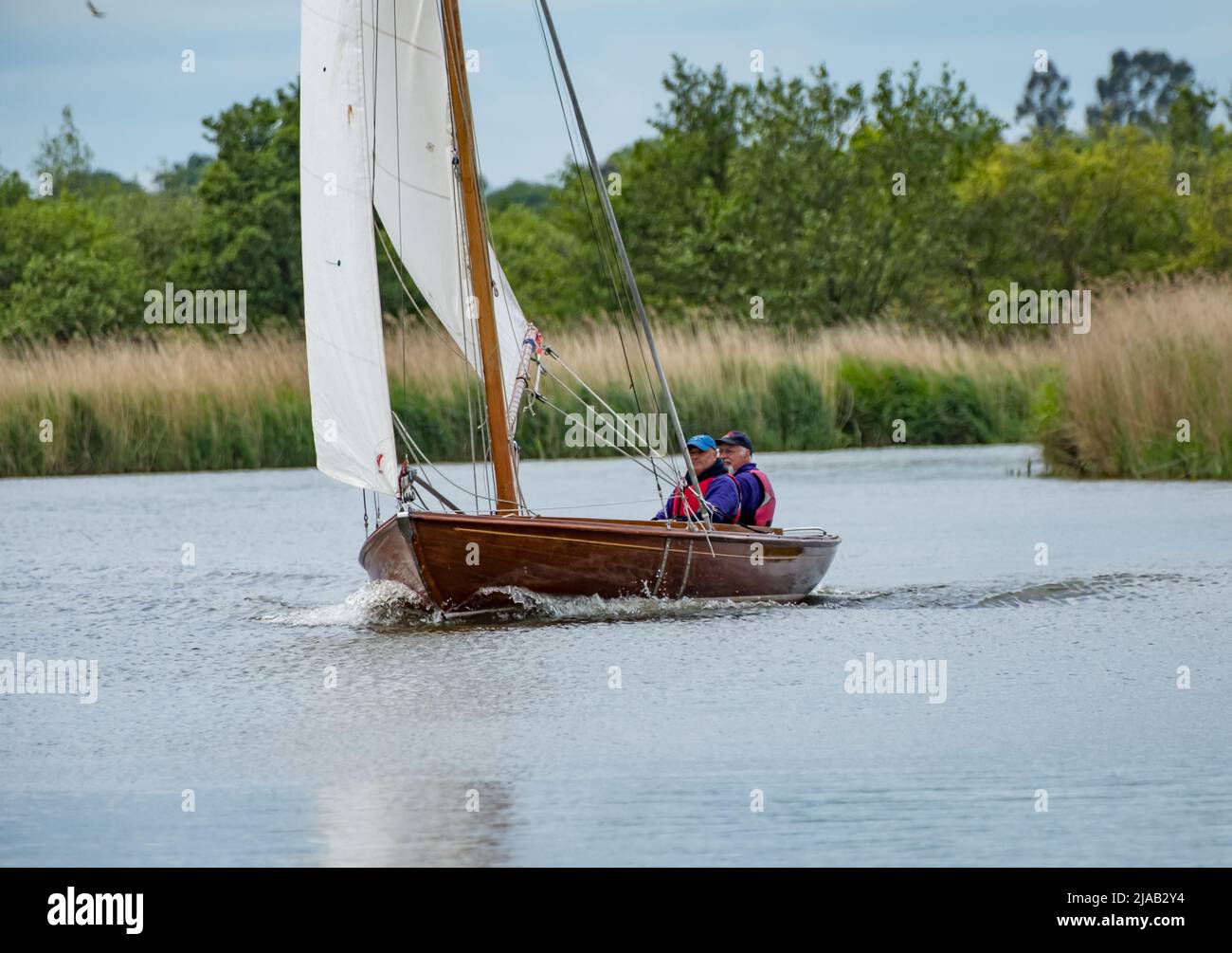 Horning, Norfolk, UK – May 28 2022. The current leaders of the 2022 Three Rivers boat race, held on the Norfolk Broads, sailing a Rebel boat on the Ri Stock Photo