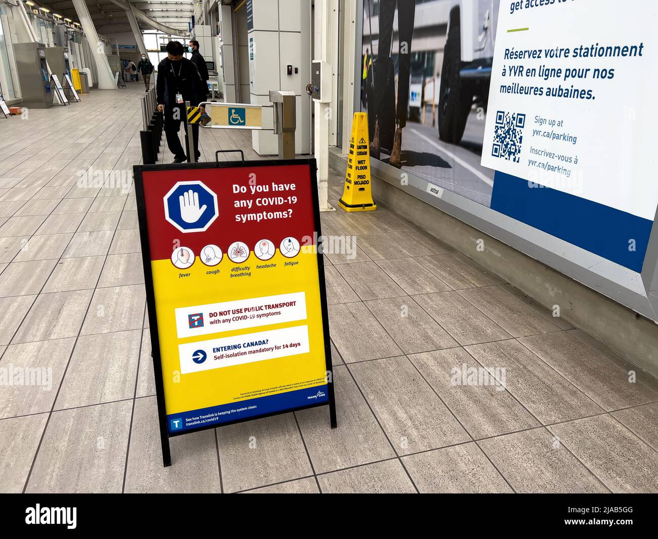 Vancouver, Canada - January 15,2022: View of sign Do you have any Covid-19 symptoms at Vancouver International Airport(YVR) Stock Photo