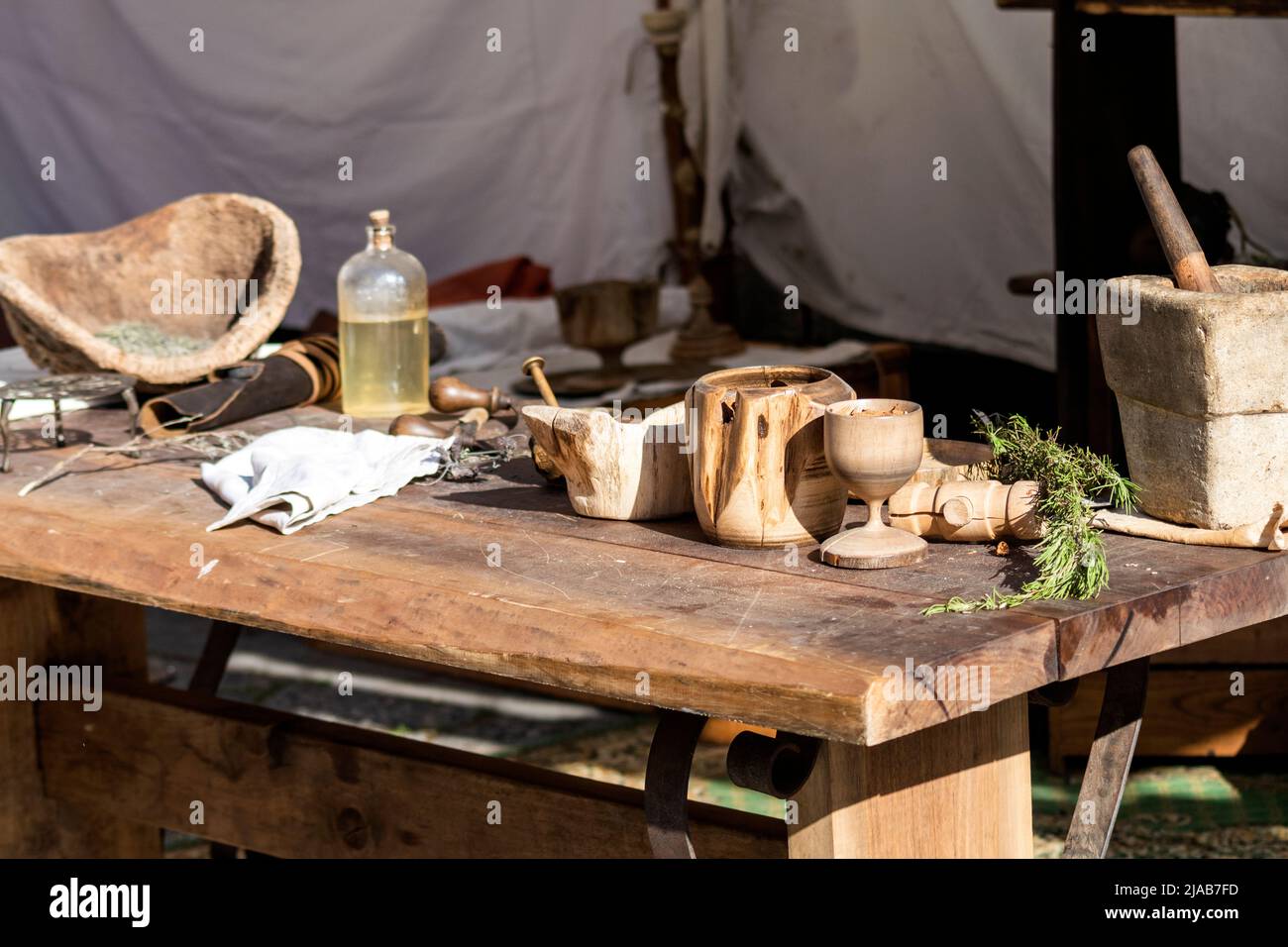 Ancient or vintage handmade tools and wood cups from Roman times. Braga Romana event in North Portugal. Recreational fairs from ancient periods. Stock Photo