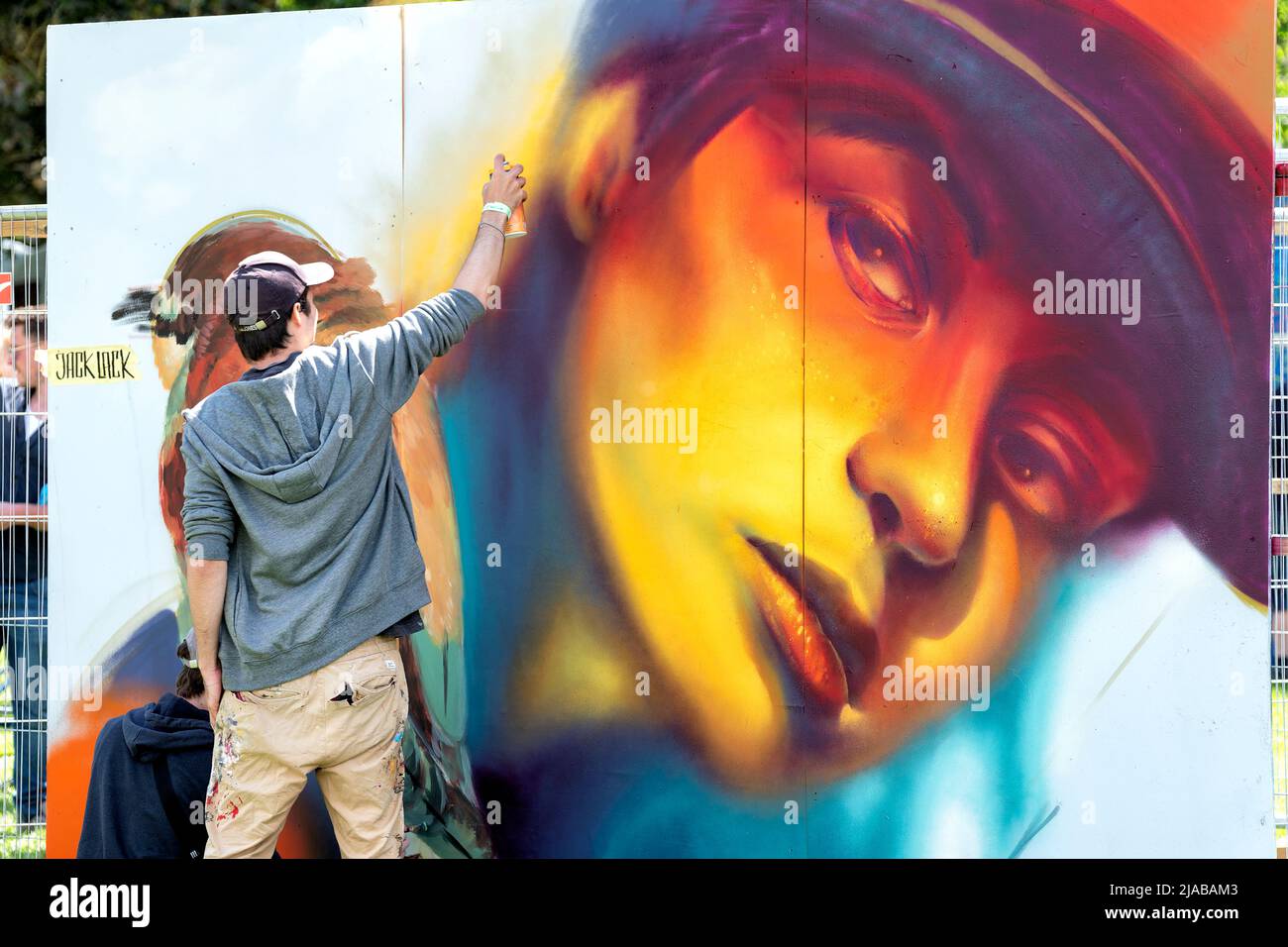 Bristol, UK. 28th May 2022. Street artist, Jack Lack, works on a large mural during the Bristol Upfest, 2022, festival. Europe's largest Street Art Stock Photo