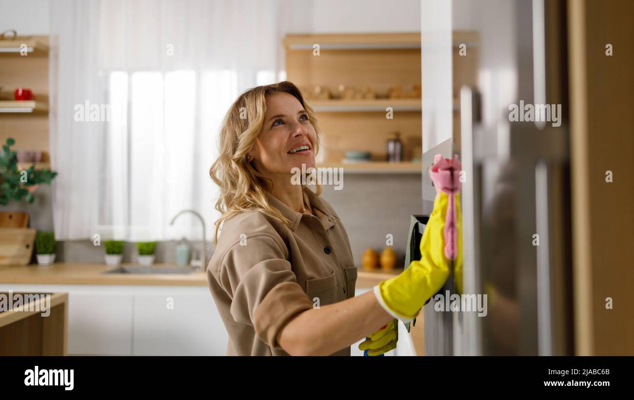 Woman cleaning fridge door hi-res stock photography and images - Alamy