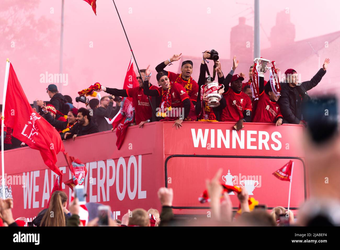 Liverpool, UK. 29th May 2022 - Despite last nights defeat at the Champions League Final, Liverpool Football Club take part in an open top bus parade to showcase the FA Cup and the Carabao Cup silverware won by the team earlier in the year. Credit: Christopher Middleton/Alamy Live News Stock Photo
