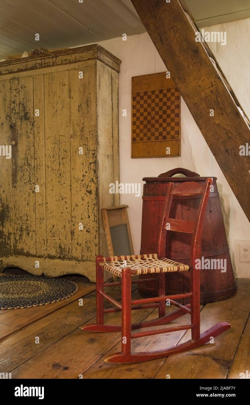 Antique rocking chair, armoire and stairs leading to attic in main ...
