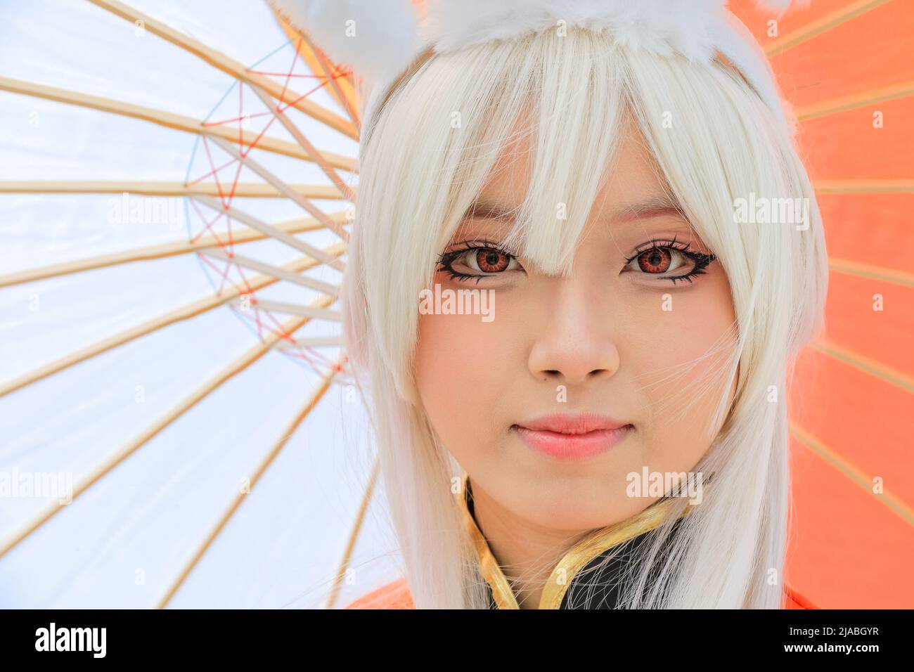 London, UK. 29th May, 2022. Young Asian woman poses in costume and wig as Gongsun Li, a characters from King of Glory (Honor of Kings), a Chinese version of the League of Legends game. Close up of face, Comic Con London. Credit: Imageplotter/Alamy Live News Stock Photo