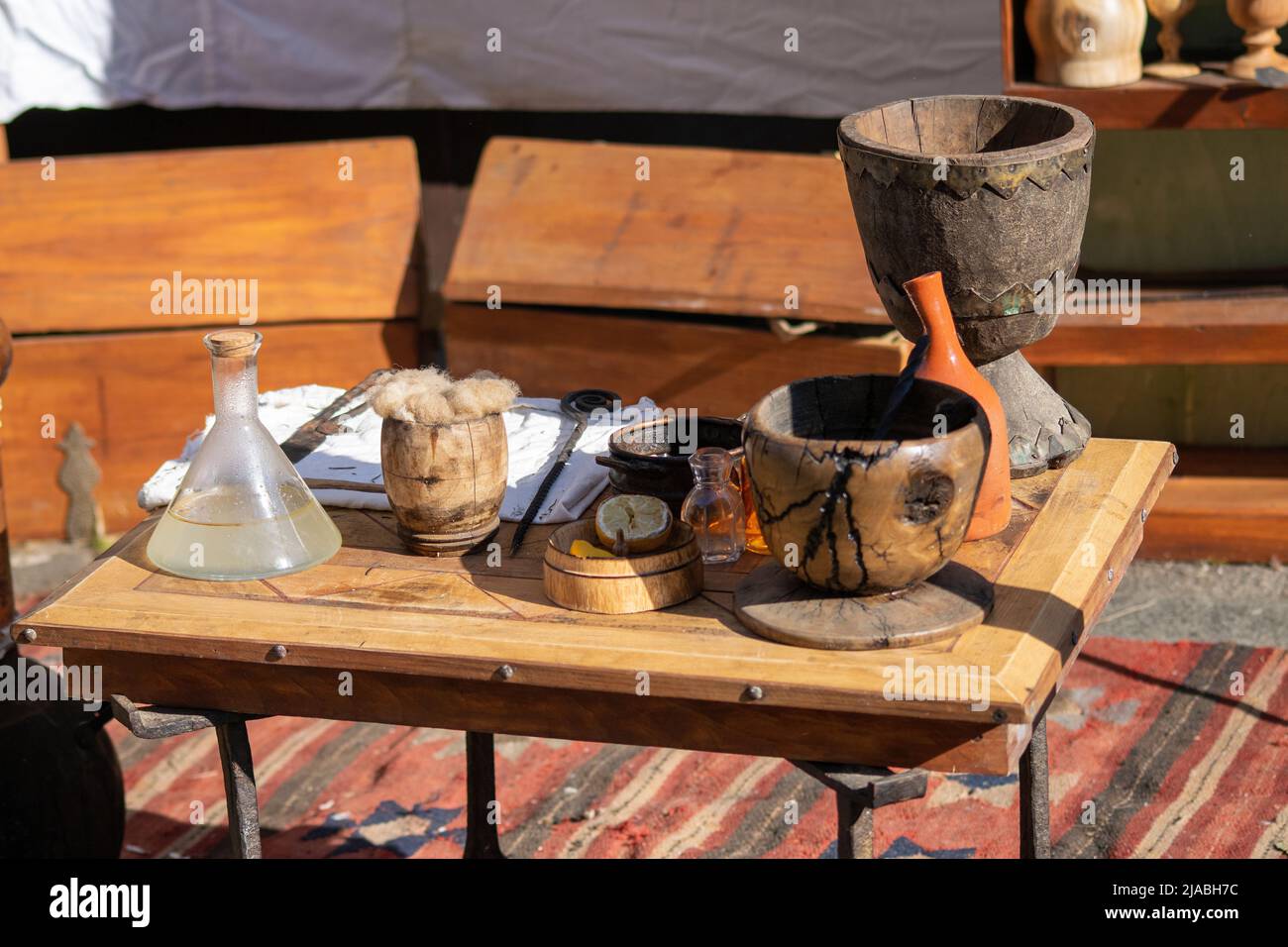 Ancient or vintage handmade tools and wood cups from Roman times. Braga Romana event in North Portugal. Recreational fairs from ancient periods. Stock Photo