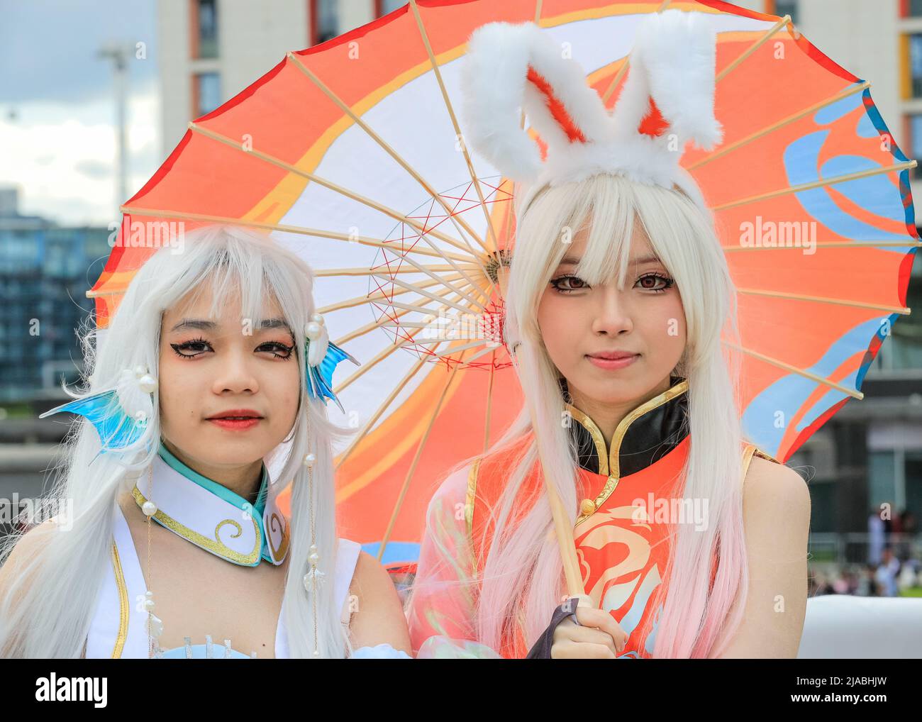 London, UK. 29th May, 2022. Two young Asian women pose in costume as Jia Luo (l), and Gongsun Li (r), female characters from King of Glory (Honor of Kings), a Chinese version of the League of Legends game. MCM Comic Con London, Excel. Credit: Imageplotter/Alamy Live News Stock Photo
