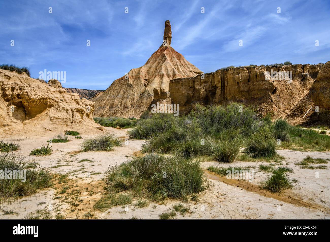 View of the castildetierra, the most famous geological formation in the Bardenas Reales desert, a spring day, with some vegetation. Stock Photo