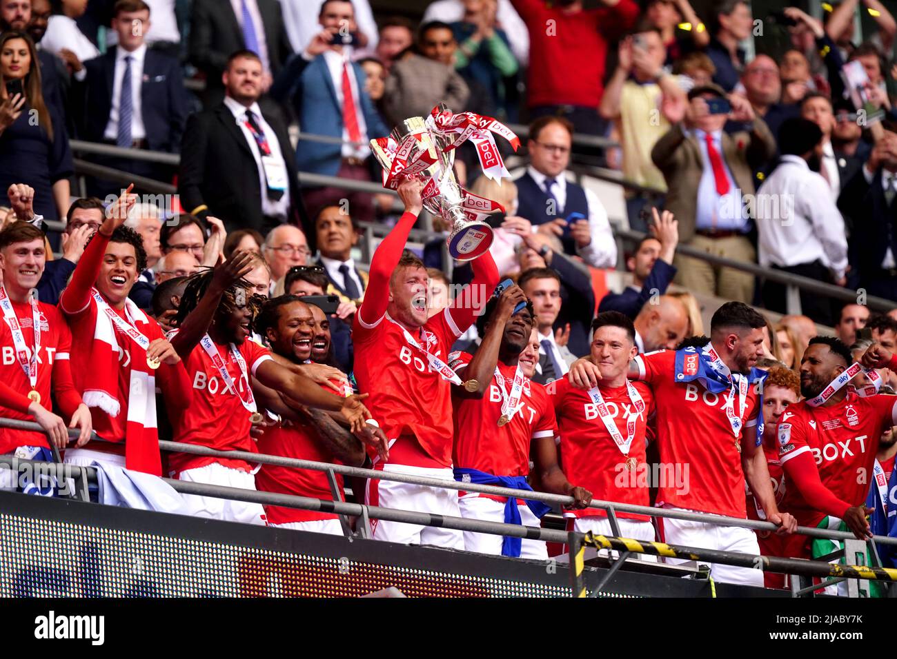 Nottingham Forest's Joe Worrall (centre) lifts the trophy in the stands