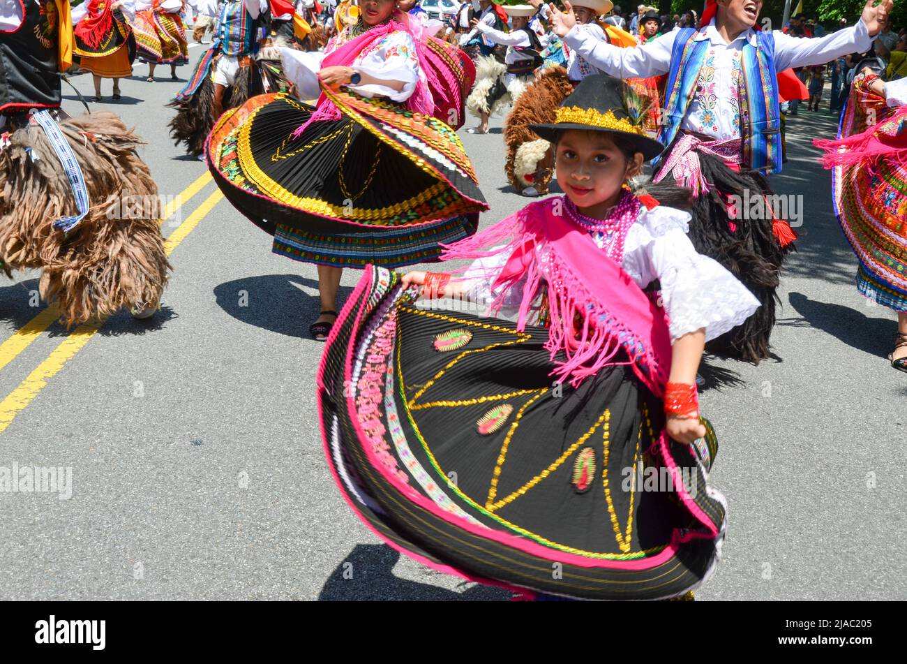 Girls are seen dancing with traditional Ecuadorian outfits during the Ecuadorian Independence Day Parade in New York City on May 29, 2022. Stock Photo