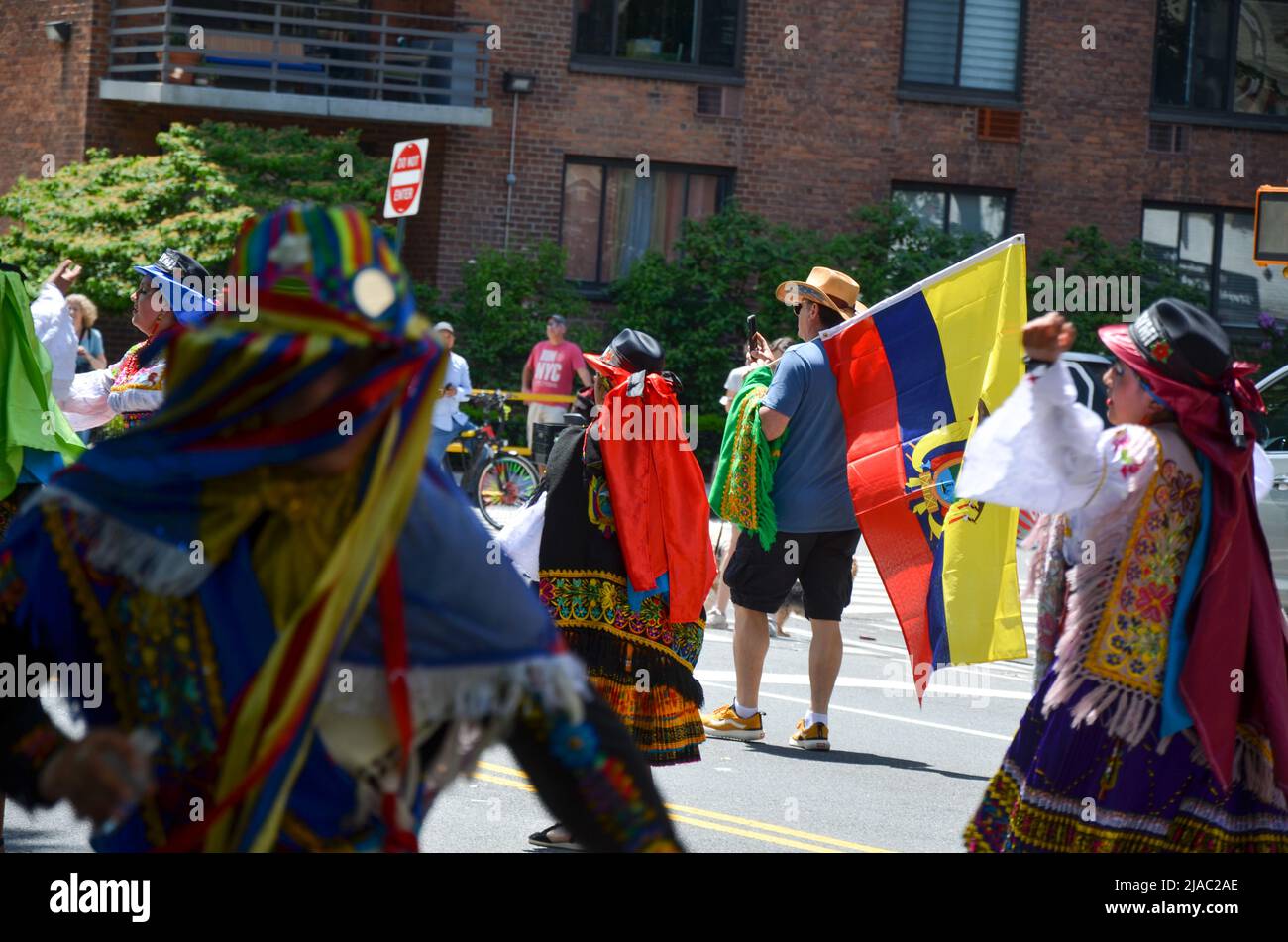 Participants honding Ecuadorian Flag, march way up Central Park West in