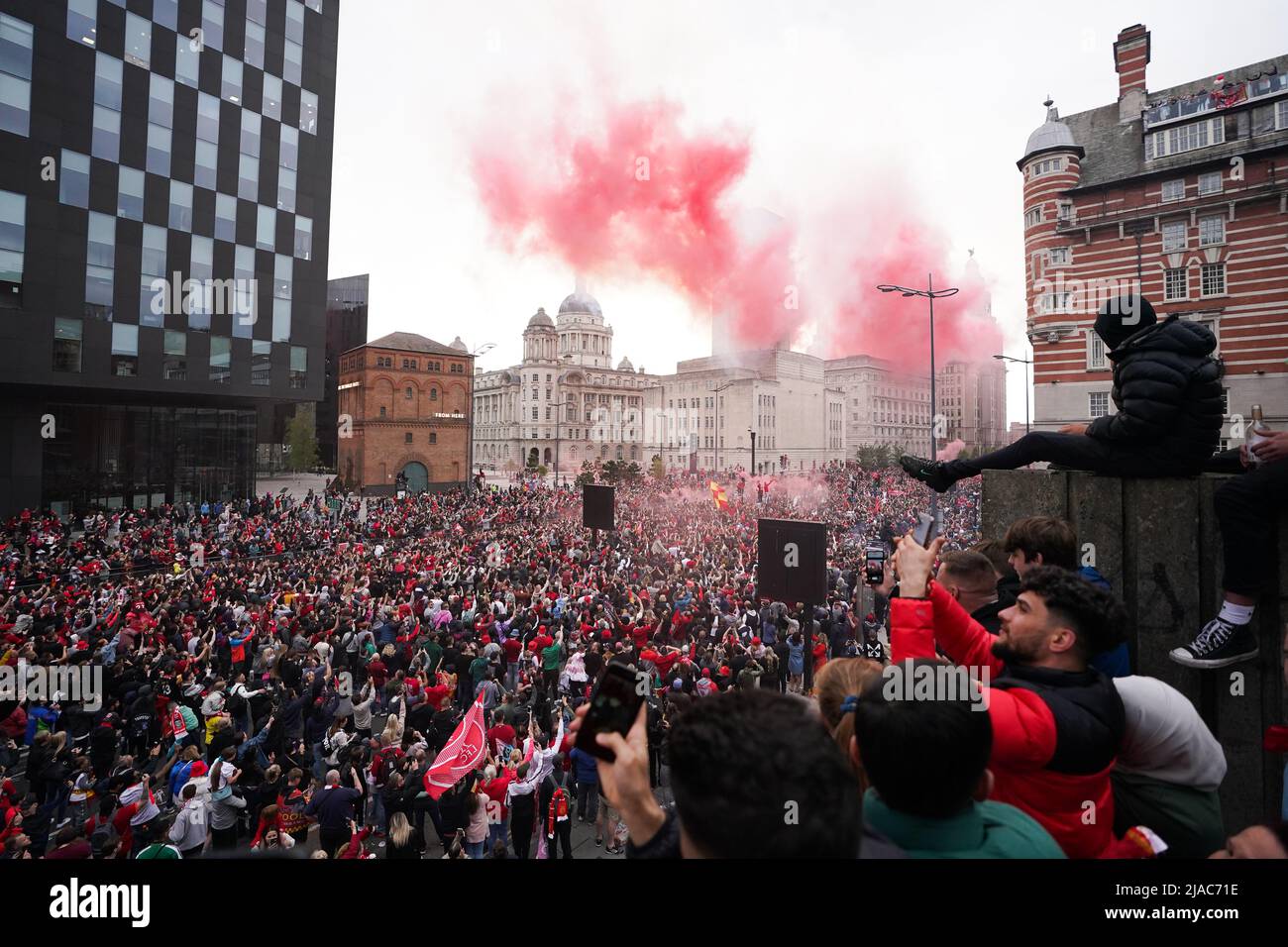 Liverpool fans celebrate during the trophy parade in Liverpool. Picture